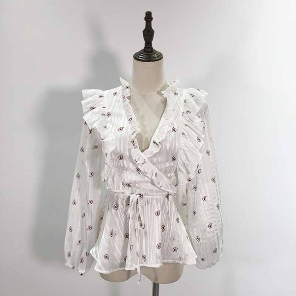 Bluză de damă cu decolteu în V adânc și legături în talie