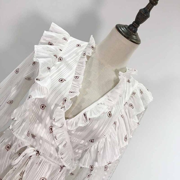 Bluză de damă cu decolteu în V adânc și legături în talie