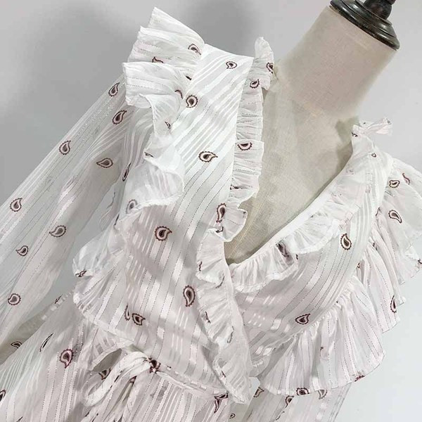 Bluză de damă cu decolteu în V adânc și legături în talie