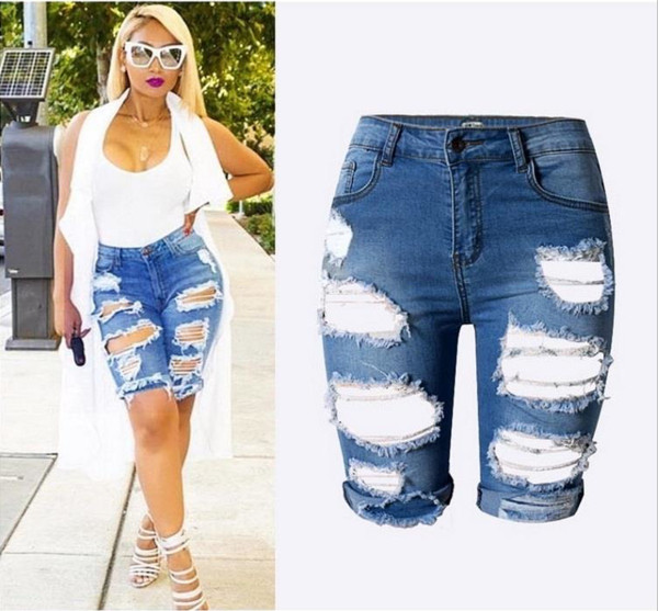 Női modern nadrág 3/4 hosszban, szakadt motívumokkal