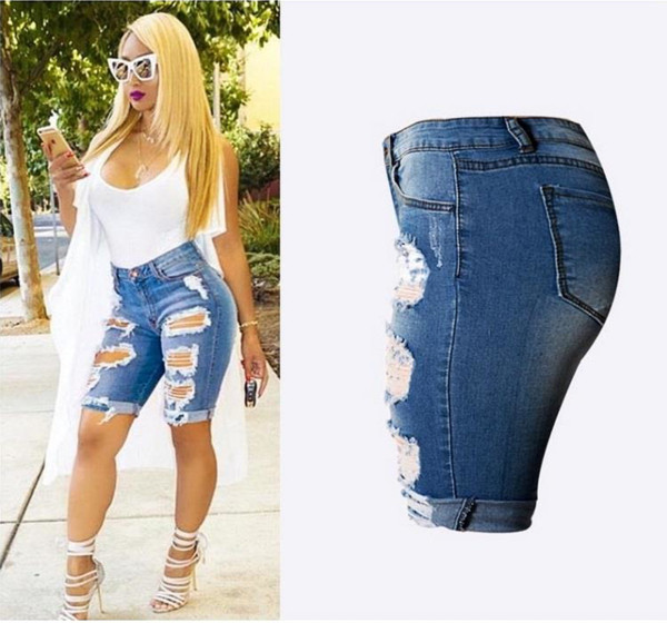 Női modern nadrág 3/4 hosszban, szakadt motívumokkal