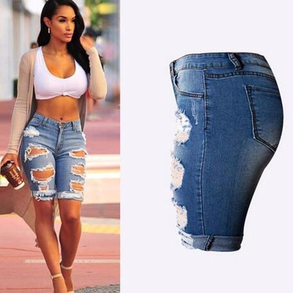 Női modern nadrág 3/4 hosszban, szakadt motívumokkal