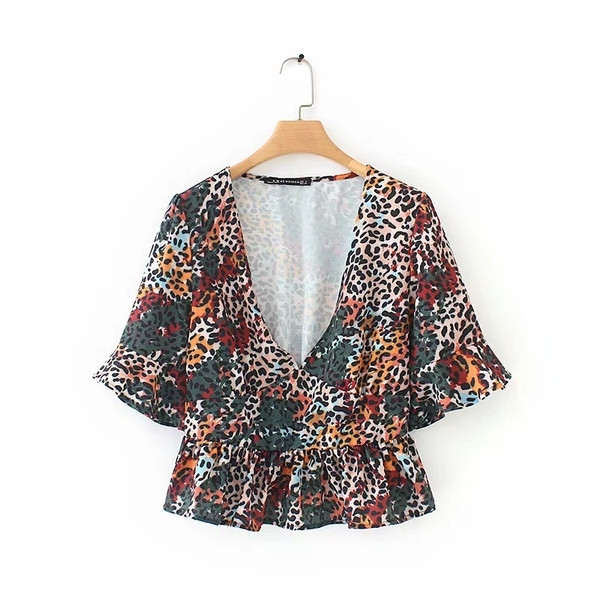 Modern női blúz mély V-nyakkal és mintával