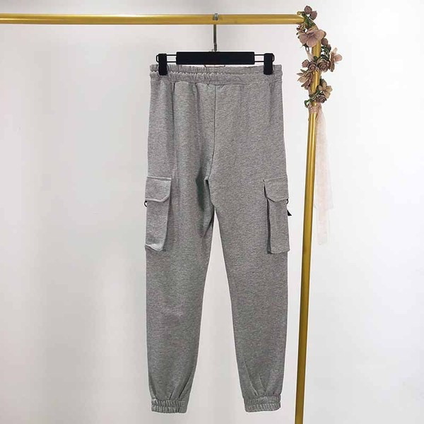 Pantaloni sport de dama cu buzunare laterale