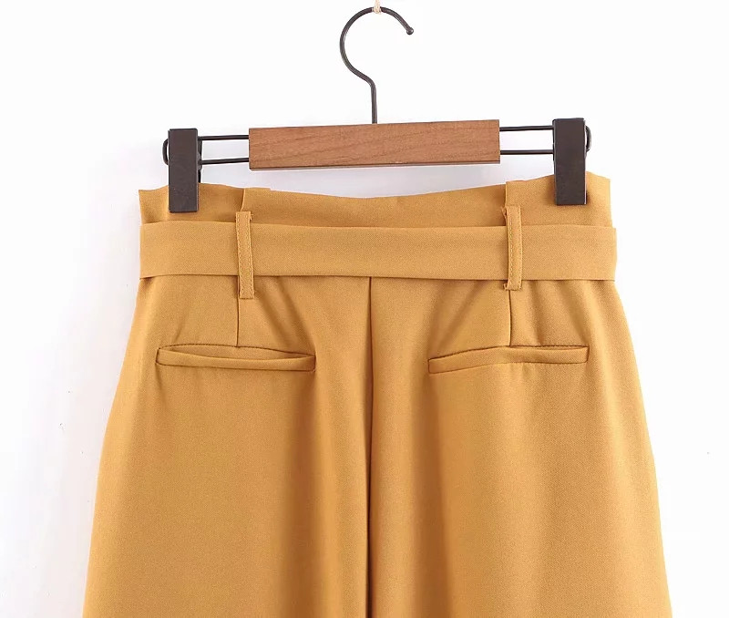 Modern női nadrág magas derékkal és övvel