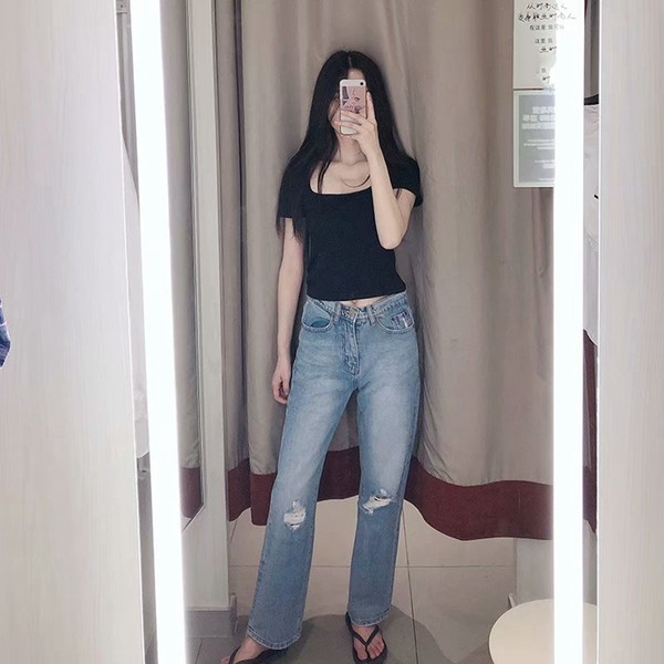 Női kék farmer magas derékkal, szakadt motívummal