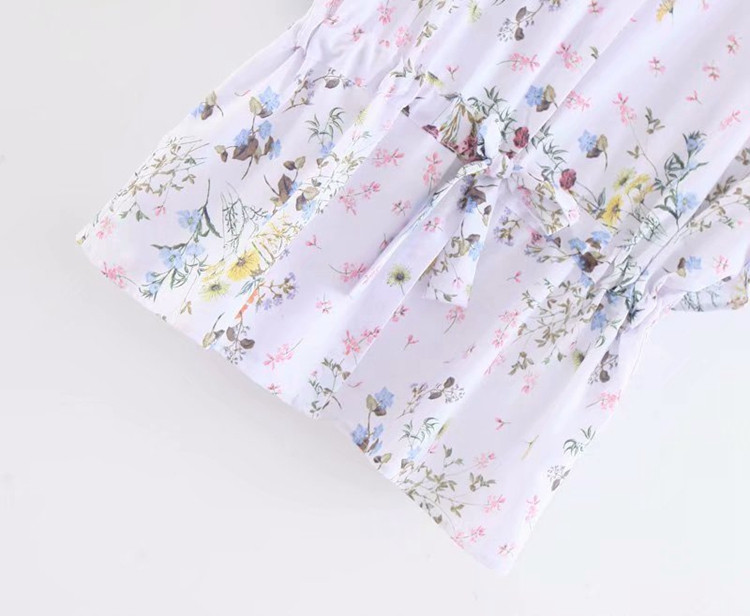 Bluză de damă cu legături în talie în alb cu model