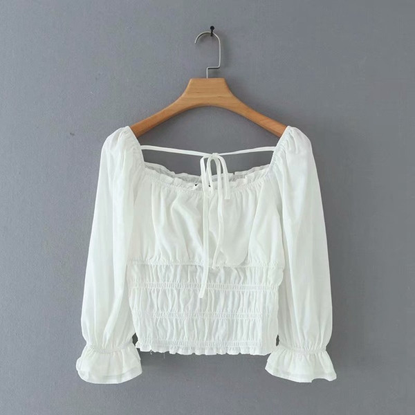 Női rövid blúz elasztikus derékkal, fehér színben