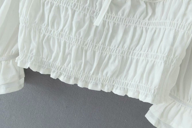 Női rövid blúz elasztikus derékkal, fehér színben