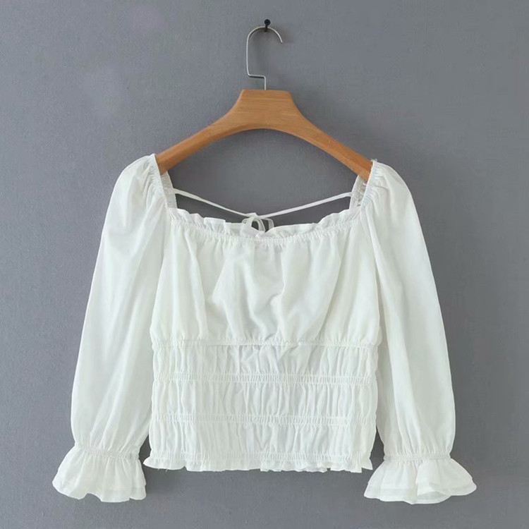 Női rövid blúz elasztikus derékkal, fehér színben