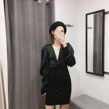 Elegáns fekete ruha mély V-nyakkal