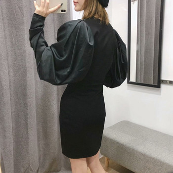 Elegáns fekete ruha mély V-nyakkal