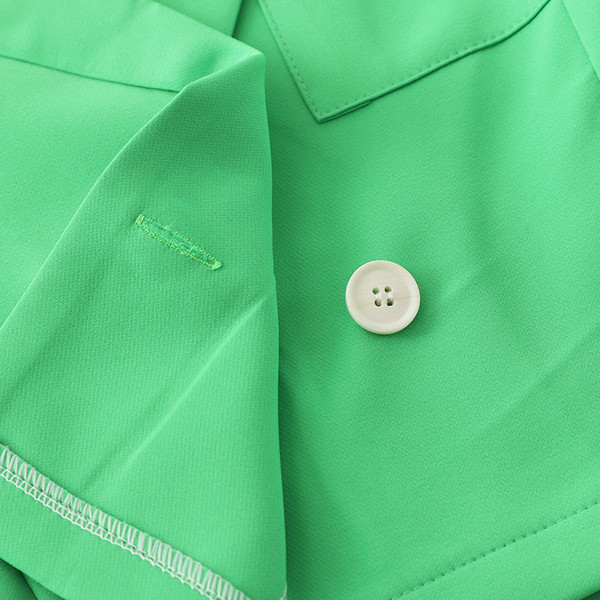 Női rövid modellkabát fekete és zöld színben