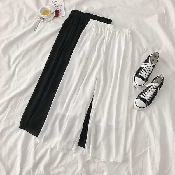 Női széles modellnadrág fehér és fekete színben