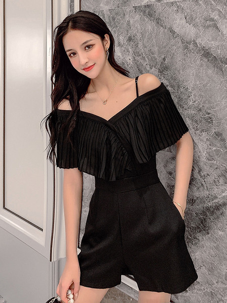 Stílusos női overall fehér és fekete színben