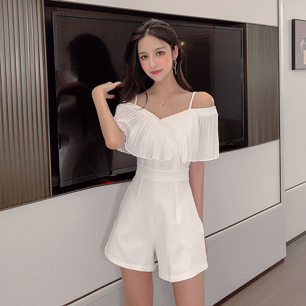 Stílusos női overall fehér és fekete színben