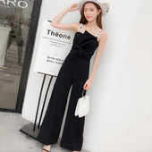 Salopetă elegantă de damă, de culoare neagră, cu bretele subțiri