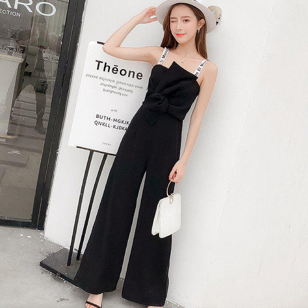 Salopetă elegantă de damă, de culoare neagră, cu bretele subțiri