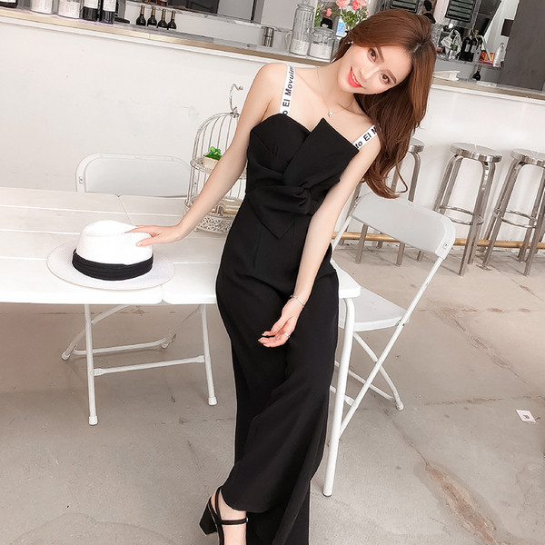 Salopetă elegantă de damă, de culoare neagră, cu bretele subțiri