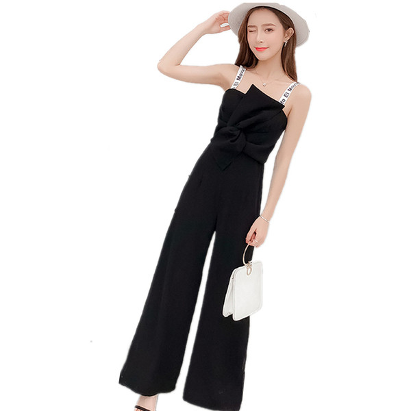 Salopetă elegantă de damă, de culoare neagră, cu bretele subțiri