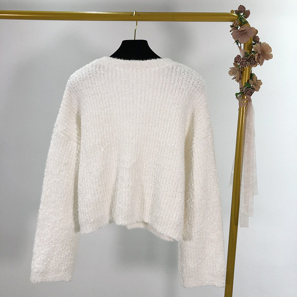 Rövid női mellény gyöngyház gombokkal, fehér színben