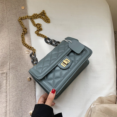 Modern női bőr táska fém rögzítéssel