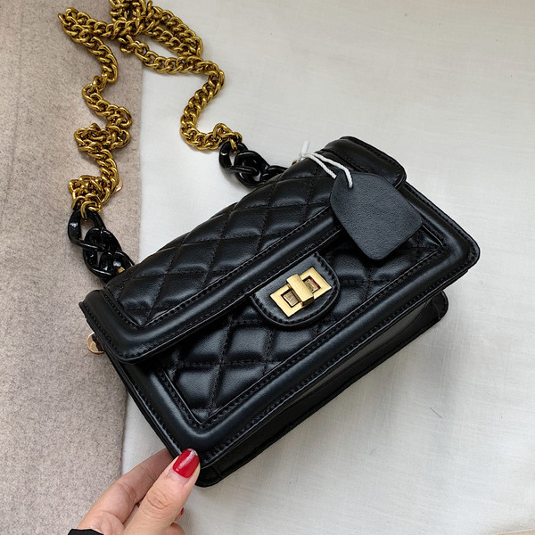 Modern női bőr táska fém rögzítéssel