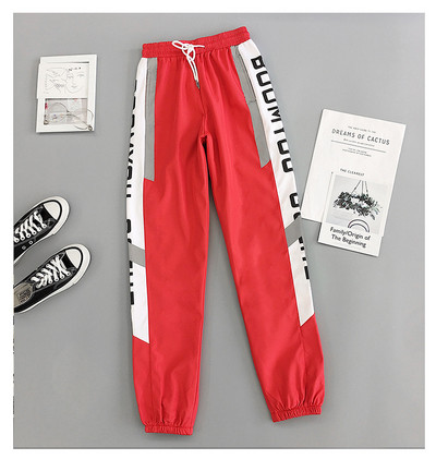 Sport és alkalmi női nadrág piros és fekete színben