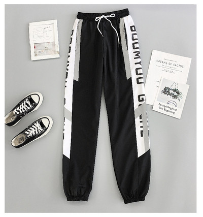 Sport és alkalmi női nadrág piros és fekete színben