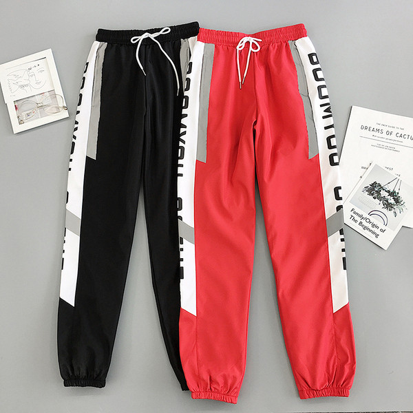 Sport és alkalmi női nadrág piros és fekete színben