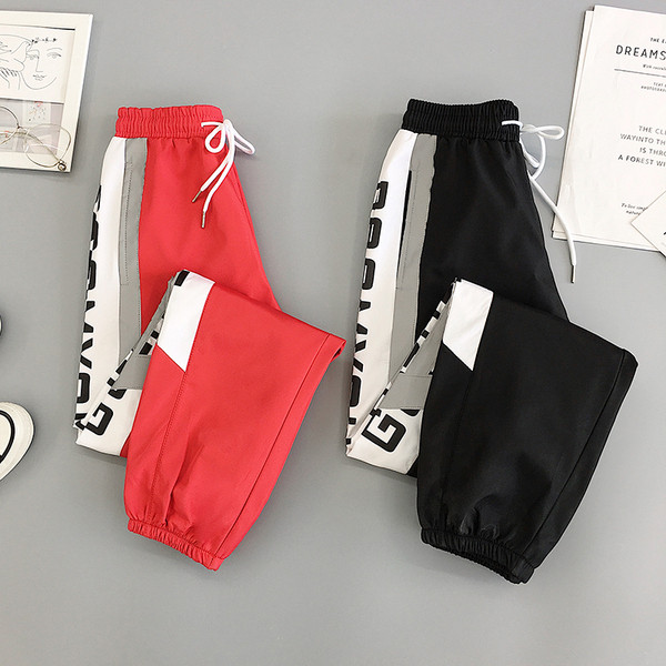 Sport és alkalmi női nadrág piros és fekete színben