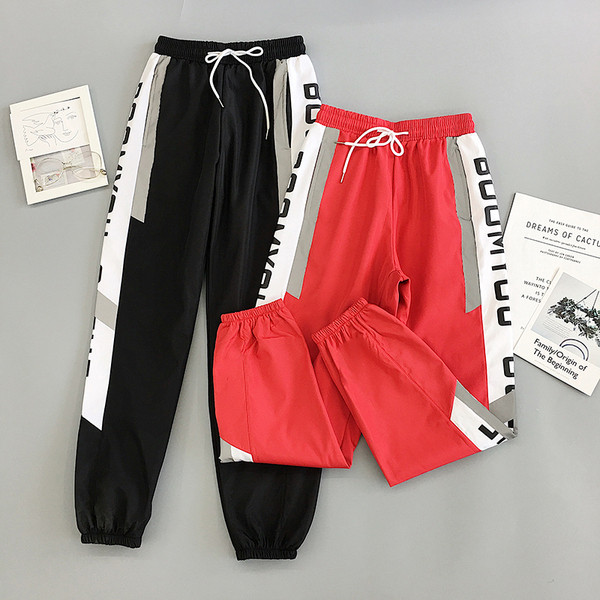 Sport és alkalmi női nadrág piros és fekete színben