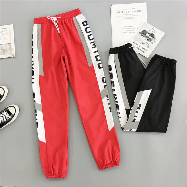 Sport és alkalmi női nadrág piros és fekete színben