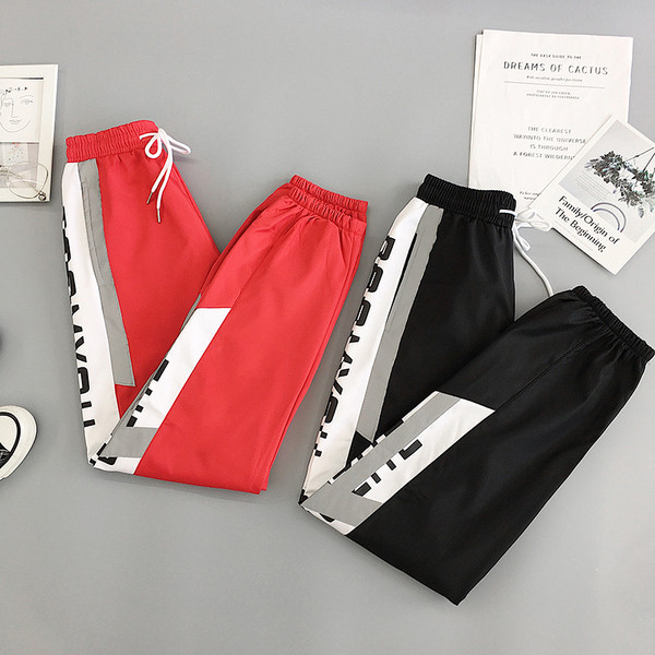 Sport és alkalmi női nadrág piros és fekete színben