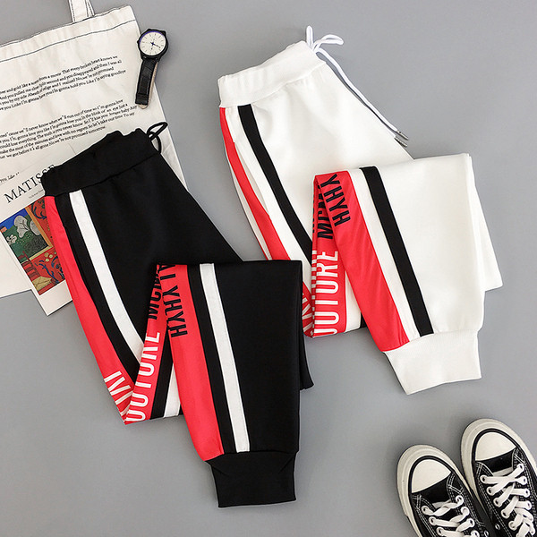 Női alkalmi nadrág fekete-fehér színben