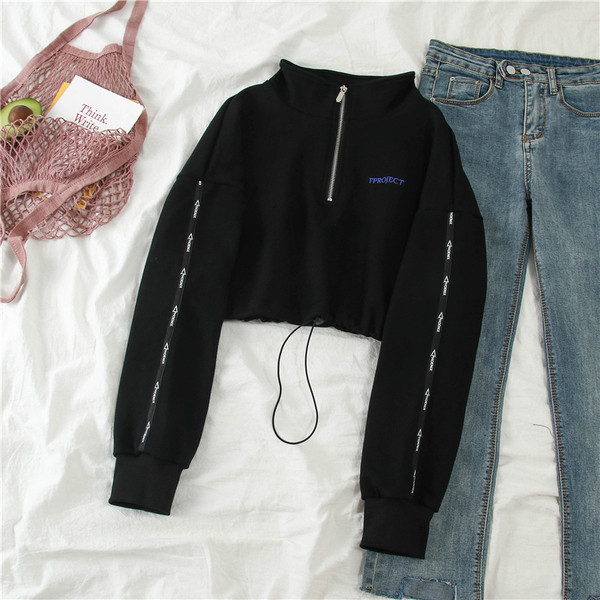 Sport-alkalmi női blúz cipzárral és nyakkendővel