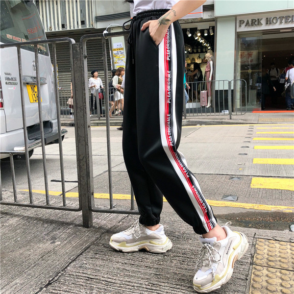 Pantaloni sport de damă alb-negru cu margini