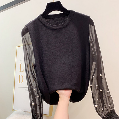 Különböző színekben gyöngyökkel díszített modern női pulóver