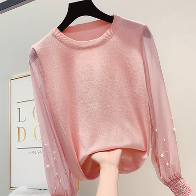 Különböző színekben gyöngyökkel díszített modern női pulóver