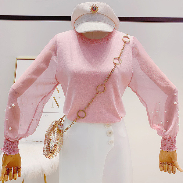 Különböző színekben gyöngyökkel díszített modern női pulóver