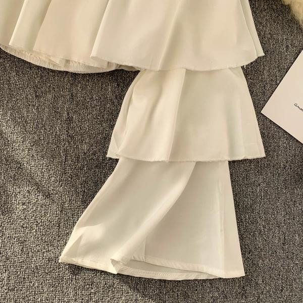 Bluză de damă actuală cu mâneci căzute în alb-negru