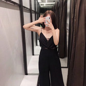 Elegáns női overall vékony pántokkal, fekete színben