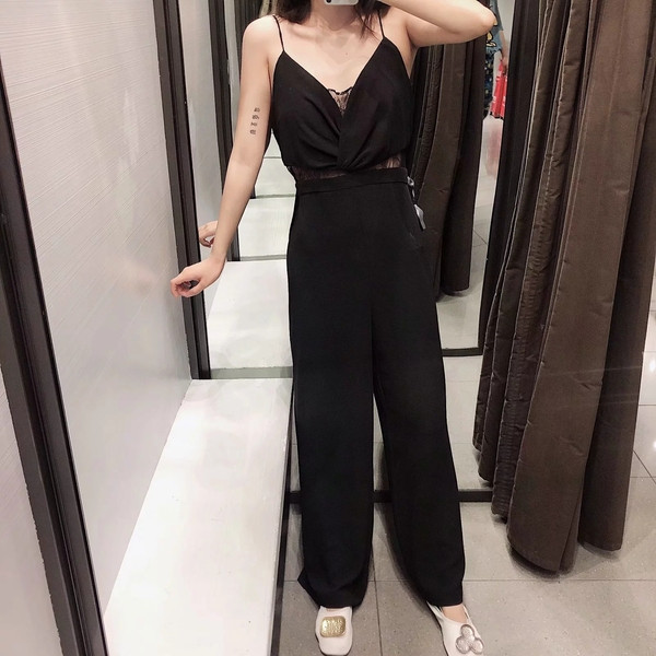 Elegáns női overall vékony pántokkal, fekete színben