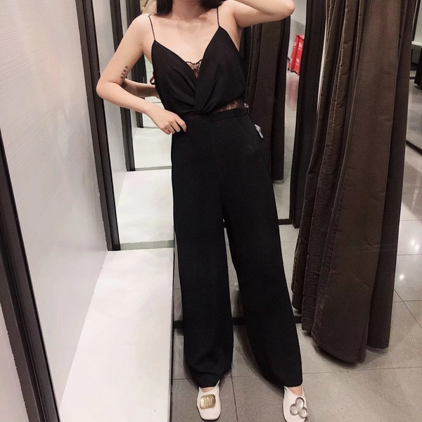 Elegáns női overall vékony pántokkal, fekete színben