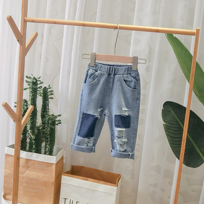 Blugi moderni pentru copii in albastru cu motive rupte pentru baieti