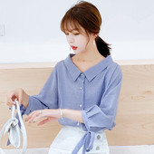 Aktuális női ing kék színben, gombokkal és nyakkendőkkel