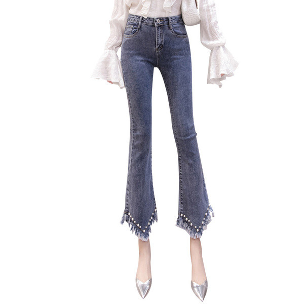 Aktuális női farmer kék színben, díszítőgyöngyökkel és rojtokkal