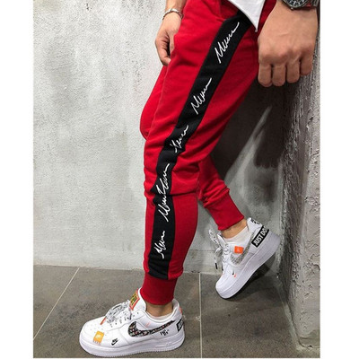 Férfi sportnadrág elasztikus derékkal, színes szegéllyel