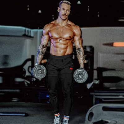 Спортно мъжко долнище с джобове в черен и бял цвят