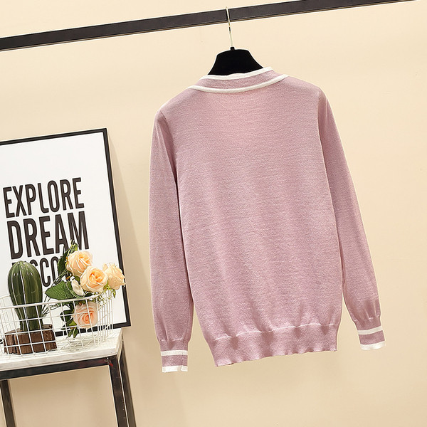 Női pulóver fekete és lila szalaggal